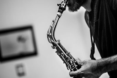 Close-up of man playing saxophone