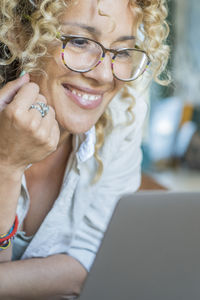 Close-up of woman using laptop