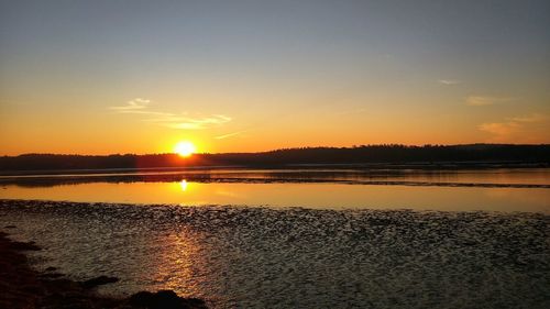 Scenic view of sunset over sea