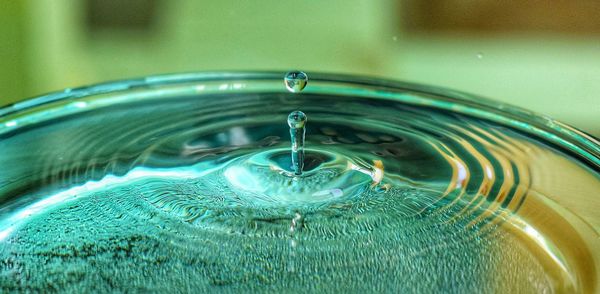 Close-up of drop splashing in glass