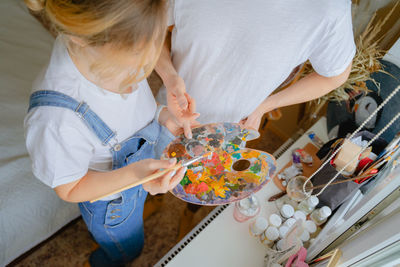 Midsection of woman preparing food at home