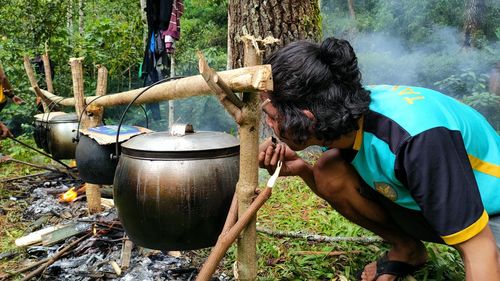 People in traditional clothing against trees