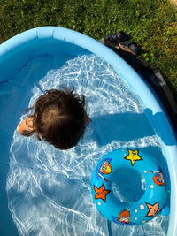 High angle view of a baby in swimming pool