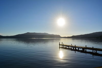 Sun shining over lake