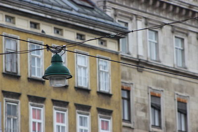 Low angle view of lantern hanging against sky