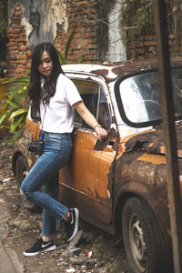 Portrait of young woman in car