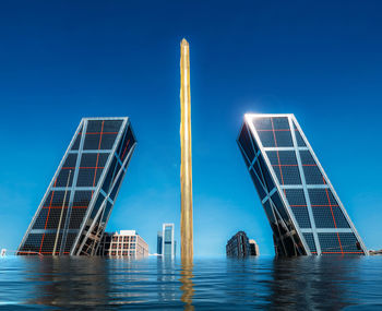 Low angle view of bridge against clear blue sky