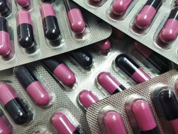 Full frame shot of pink bottles