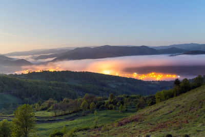 Scenic view of landscape against sky during sunset