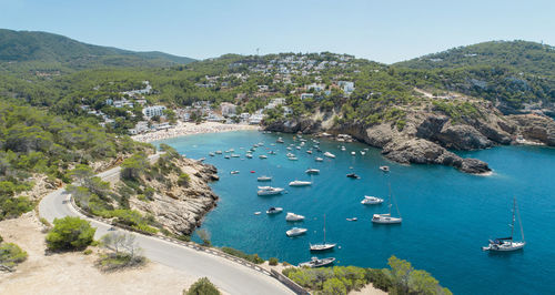 High angle view of boats sailing in sea against clear sky