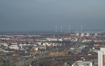 Aerial view of cityscape against sky