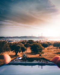 Scenic view of lake against sky during sunset