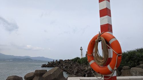 Lifeguard hut on beach against sky