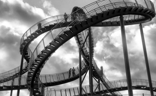 Low angle view of ferris wheel against sky