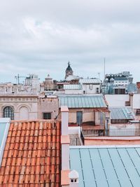 High angle view of buildings in city against sky