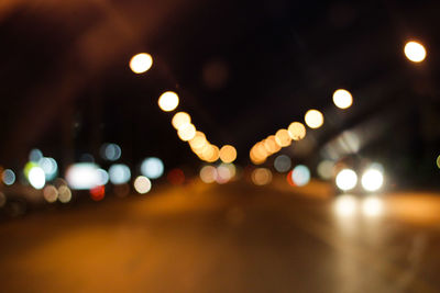 Defocused image of illuminated lights at night