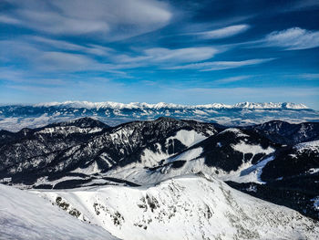 Scenic view of snowcapped mountains against sky