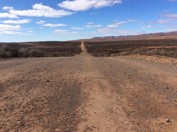 Dirt road passing through a desert