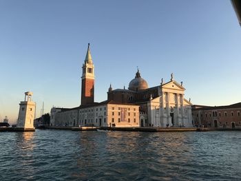 View of cathedral in city against clear sky