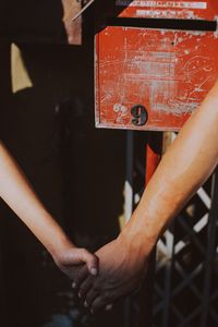 Close-up of man hand on metal