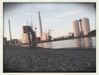 View of buildings against cloudy sky