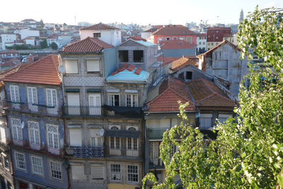 Buildings in city against clear sky