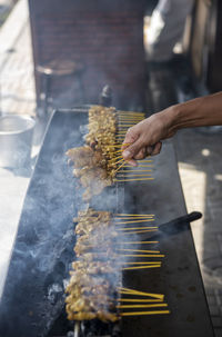 Midsection of man preparing food