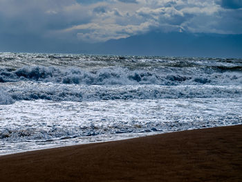 Scenic view of beach against sky