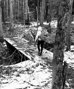 Rear view of man walking on field