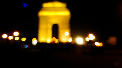 Defocused image of illuminated street lights at night