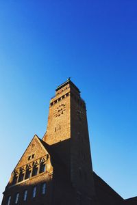 Low angle view of tower against clear blue sky