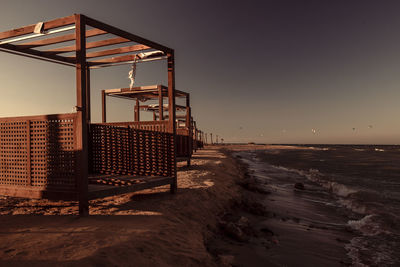 Lifeguard hut on beach against clear sky