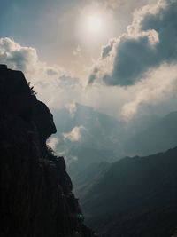 Low angle view of rocky mountains against sky