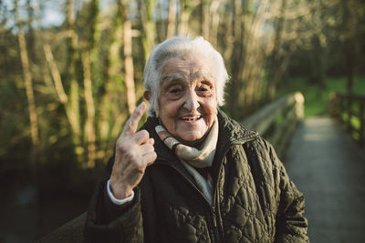 Portrait of smiling woman standing outdoors