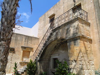 Low angle view of old building against sky