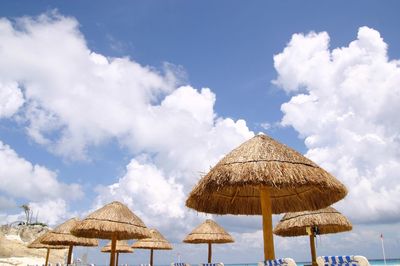 View of beach against cloudy sky