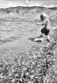 Rear view of boy on beach