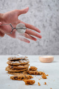 Cropped hand of person with cookies