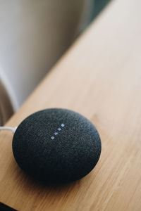 Close-up of modern speaker on table