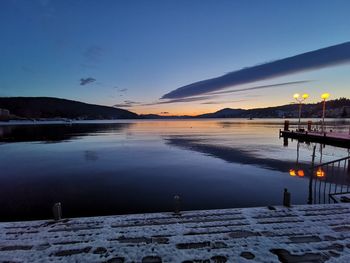 Scenic view of lake against sky during sunset