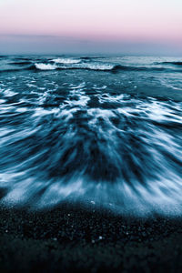 Scenic view of sea against sky at sunset