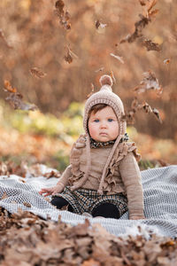 Portrait of cute boy wearing hat during autumn