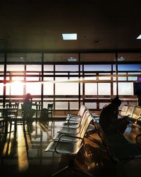 Man sitting on chair in airport