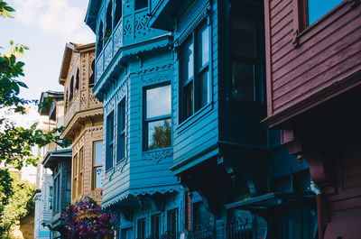 Low angle view of buildings against blue sky