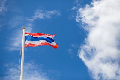 Low angle view of thai flag against sky