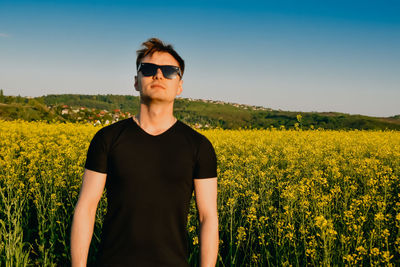 Scenic view of oilseed rape field against sky