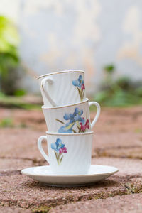 Close-up of tea cups on the floor 