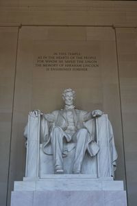 Statue in front of wall