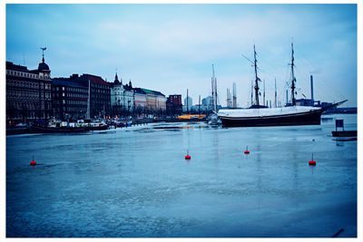 Boats moored in sea