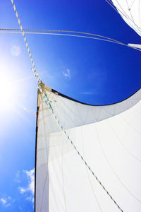 Low angle view of cables against blue sky